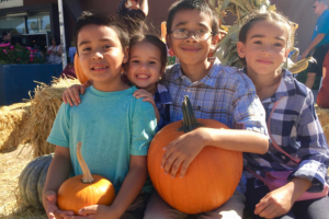 Harvest Festival Kids with Pumpkin