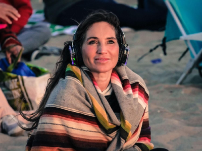 MindTravel - woman on beach with headphones